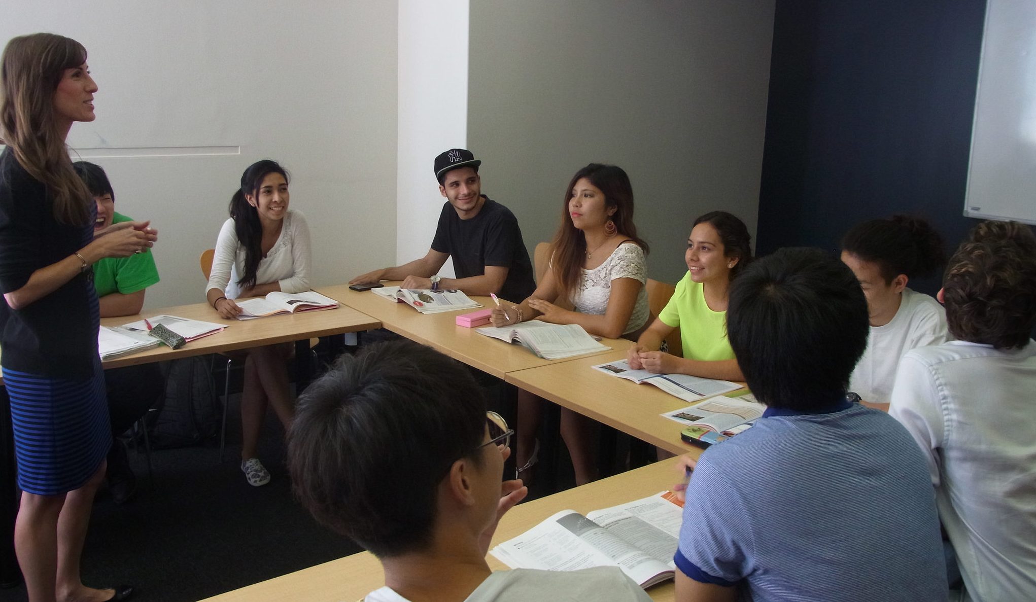 Teacher leading discussion in small classroom