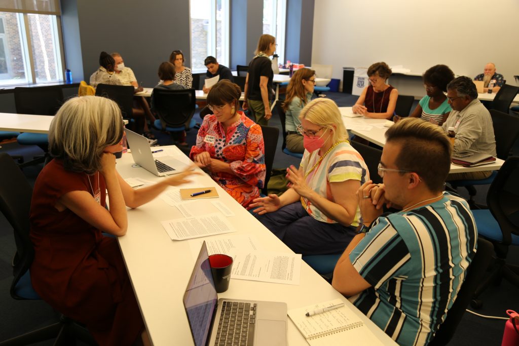 Faculty in the Active Learning Institute work in small groups in a Jigsaw exercise.