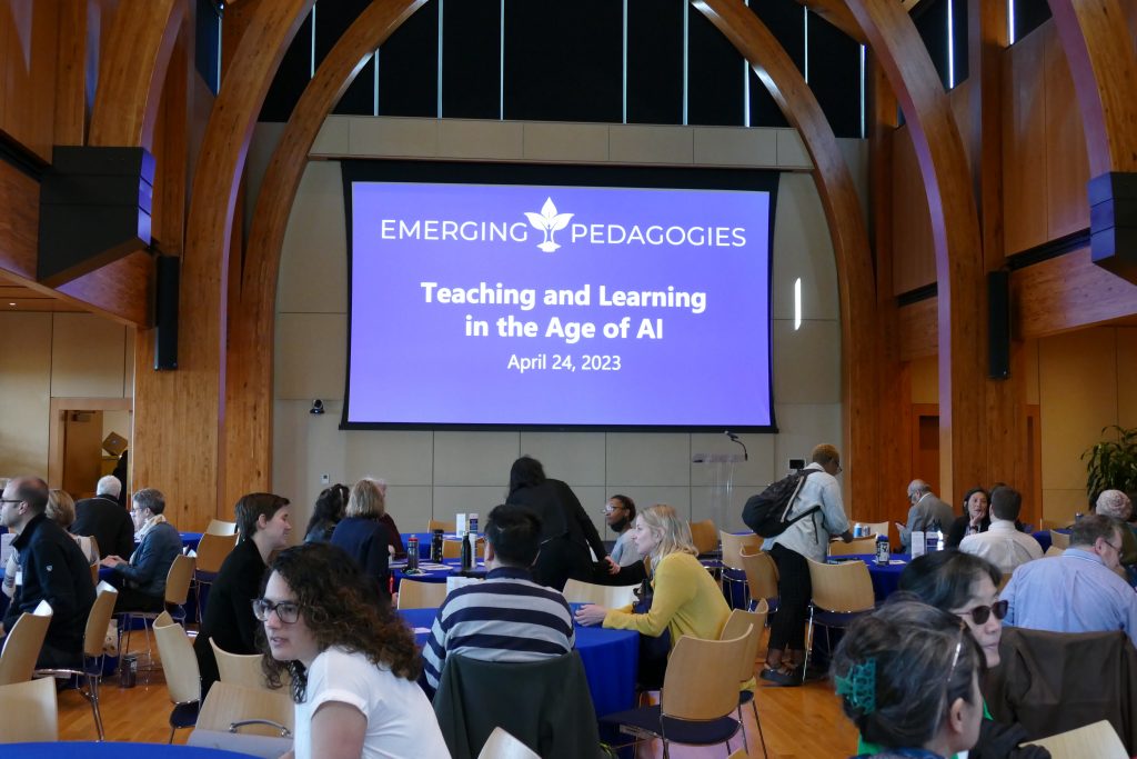 Participants chat at round tables before the event begins.