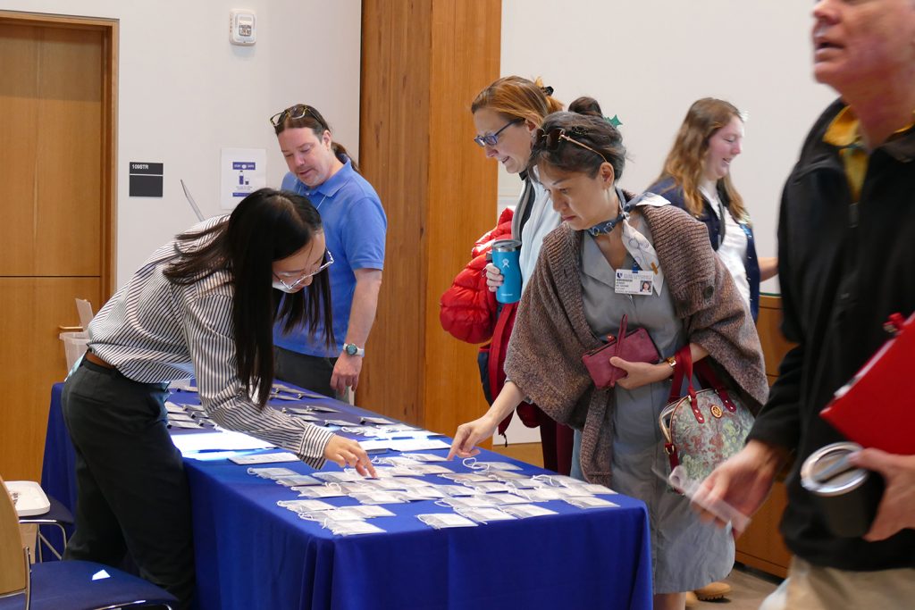 Attendees gather name tags as they arrive at Karsh Alumni and Visitor Center.